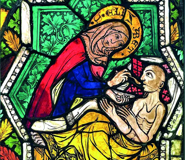 Heilige Elisabeth von Thüringen, die Patronin der Witwen, Waisen, Bettler, Kranken, unschuldig Verfolgten, Notleidenden und der Caritas. Nach einer Darstellung am Glasfenster der Pfarr- und Wallfahrtskirche Maria Buch bei Judenburg.
