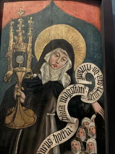 Klara von Assisi auf einem spätgotischen Holztafelgemälde als Beschützerin der Klarissen. | Foto: Schaller-Pressler